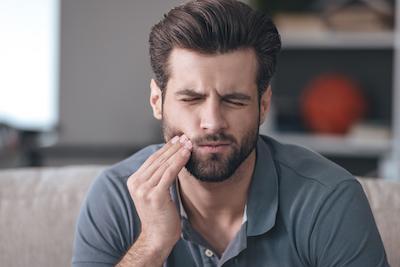 Man with Jaw Pain | Root Canals Avondale