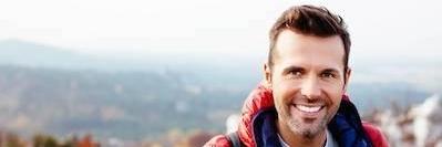 Man Outdoors Hiking | Dentist in Avondale