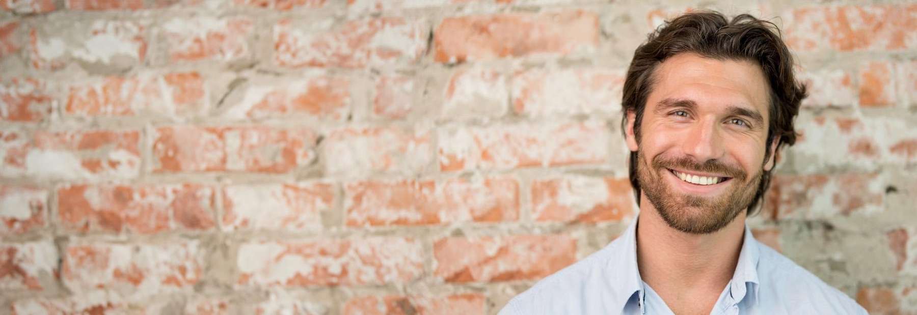 A picture of a gentleman smiling after undergoing cosmetic dentistry in Avondale Dental Centre