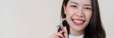 woman using invisalign New Lynn