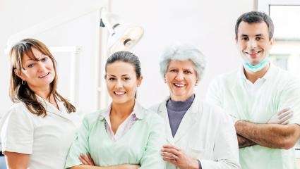 man in blue shirt smiling | Dentures in Avondale 