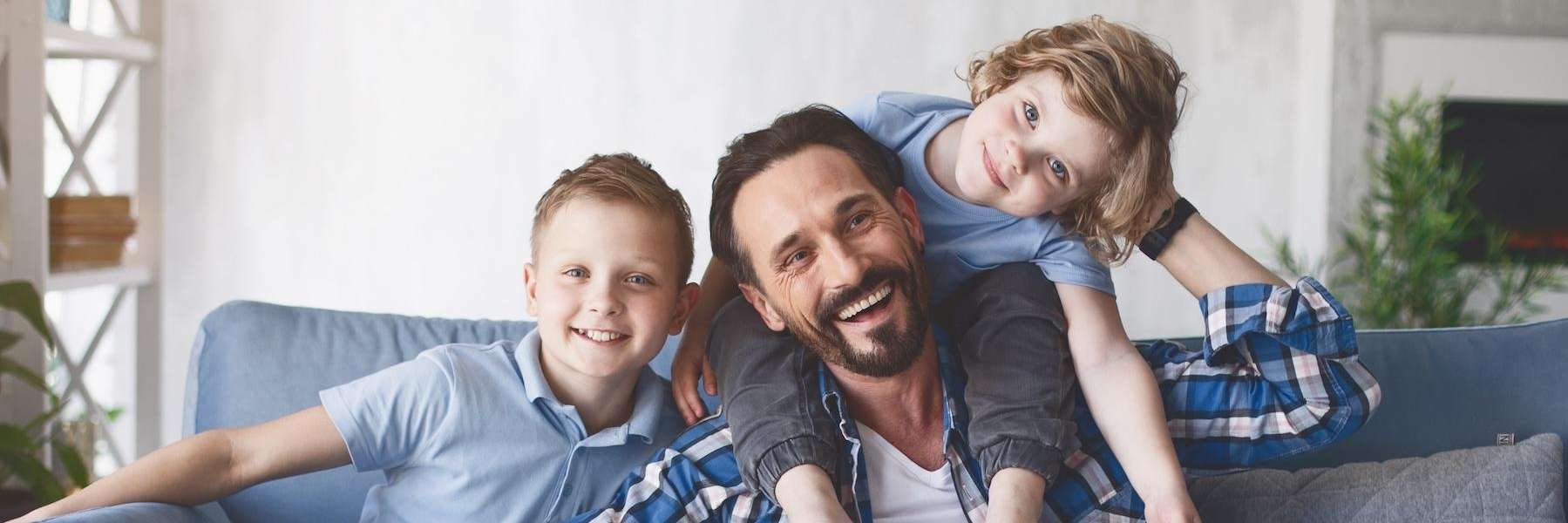 A family smiling after a dental cleaning in Avondale, Auckland